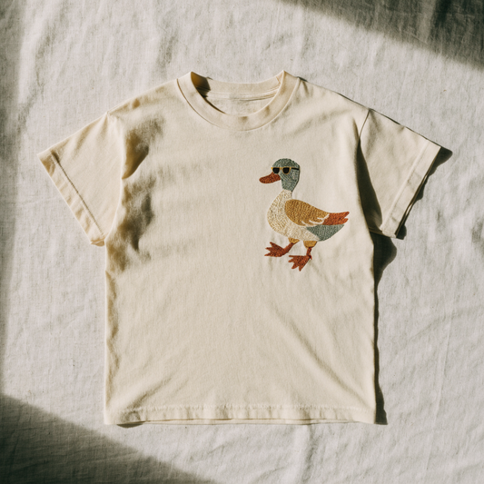 Cream cotton t-shirt with a duck in sunglasses embroidered on the left chest